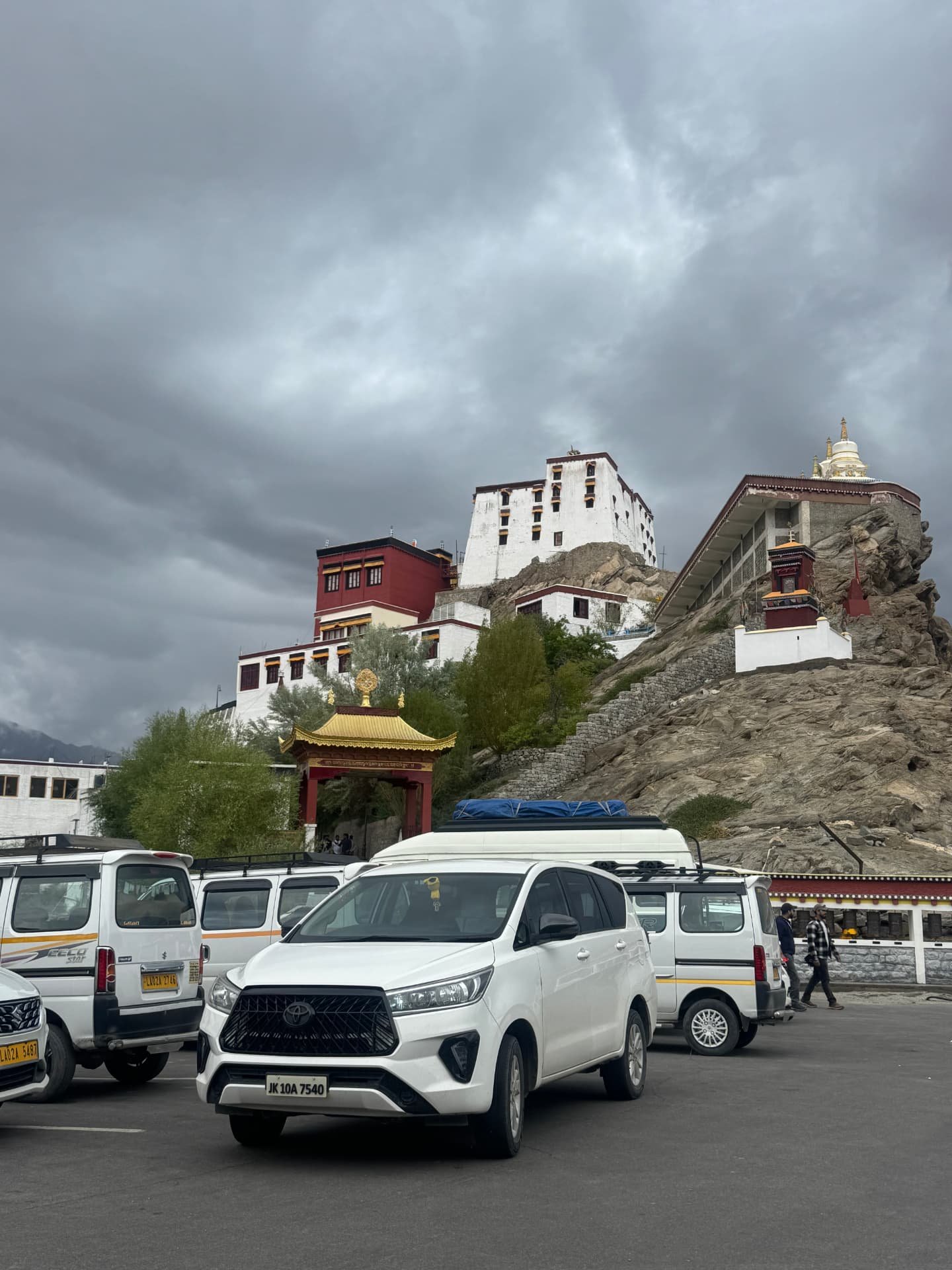 White Toyota Innova at Thiksey monastery parking in Leh
